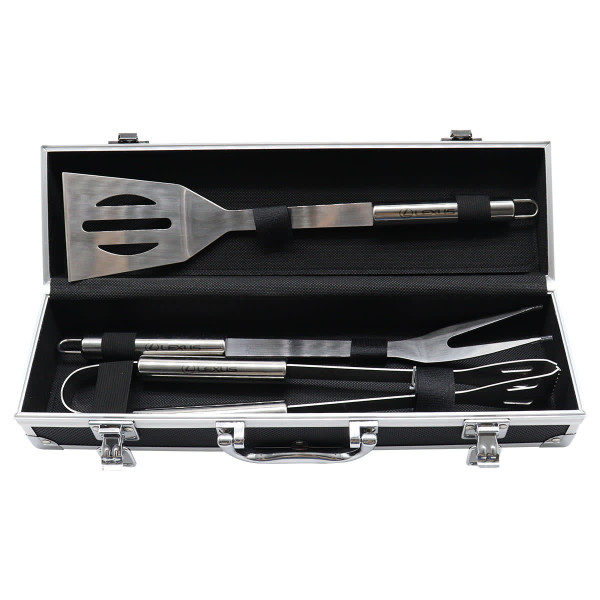 A stainless steel BBQ set with spatula, fork, and tongs in a sleek black deluxe case.