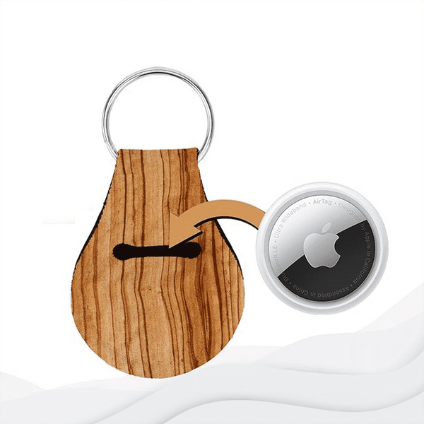 A wooden-textured neoprene keychain with a slot for an AirTag and a metal keyring.