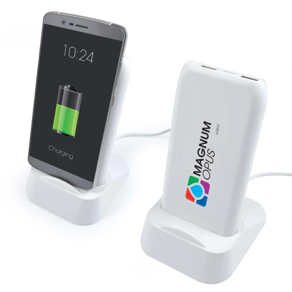 A white wireless power bank and charging station with a smartphone on a stand, displaying a charging battery icon.