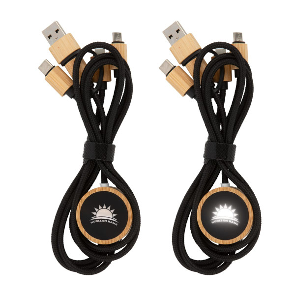 A set of black charging cables with wooden connectors and a logo on a circular wooden holder.