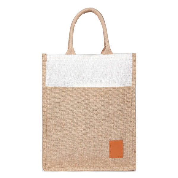 A reusable jute bag in natural brown with a white top and a brown leather patch, featuring two handles.