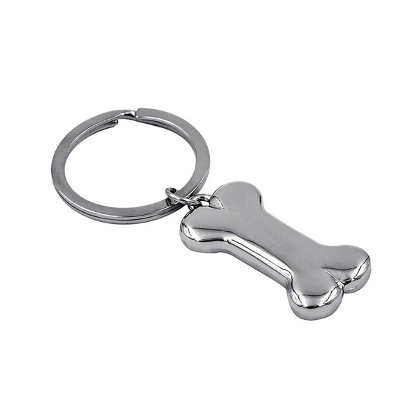 A shiny silver bone-shaped keyring attached to a metal ring. The keyring has a sleek, polished finish.