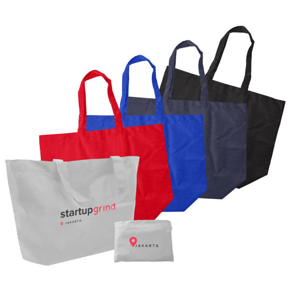 A set of foldaway shopping bags in red, blue, black, and white, featuring varying designs and one with a logo.