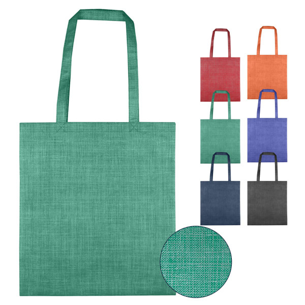 A green non-woven bag with two handles is displayed alongside bags in various colours. The texture is patterned with a subtle design.