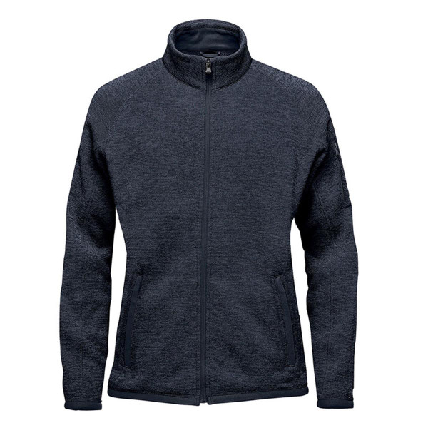 A women's full zip fleece jacket in dark grey with a logo on the sleeve and zippered pockets.