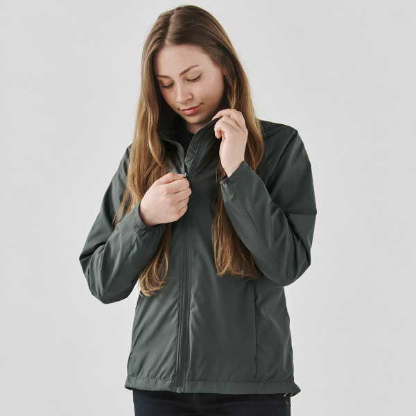 A women’s full zip rain jacket in dark grey, featuring a zippered front and a subtle logo.