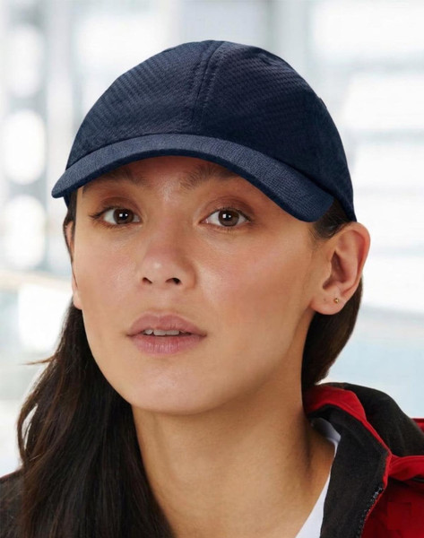 A white athletic mesh cap featuring a rounded crown and a stiff peak, complete with a logo.