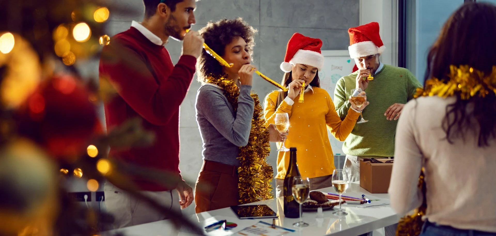 A corporate office team celebrating during the team's business Christmas party