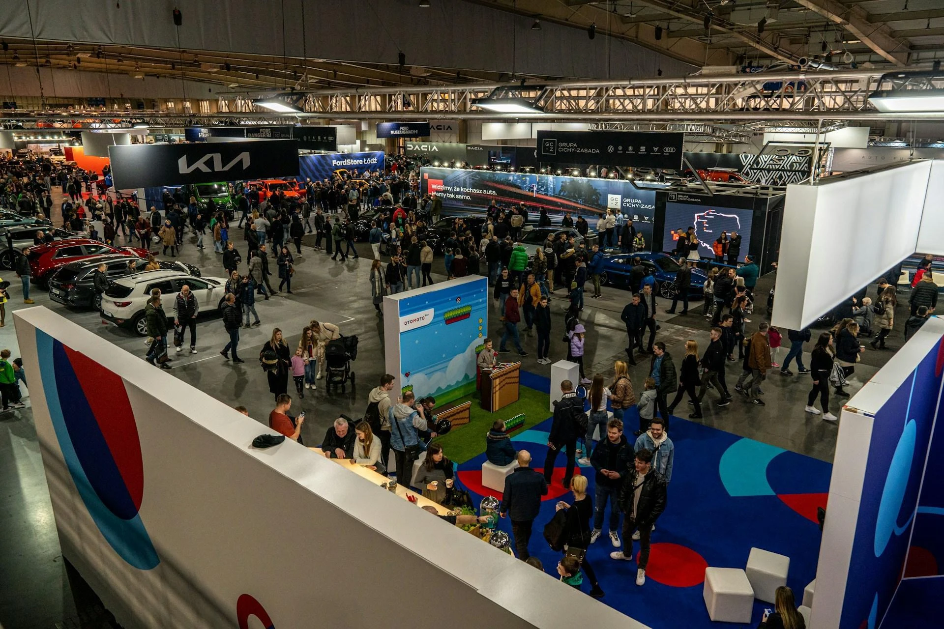 An aerial photo of a car and vehicle tradeshow with some of the biggest automotive manufacturers, such as Kia