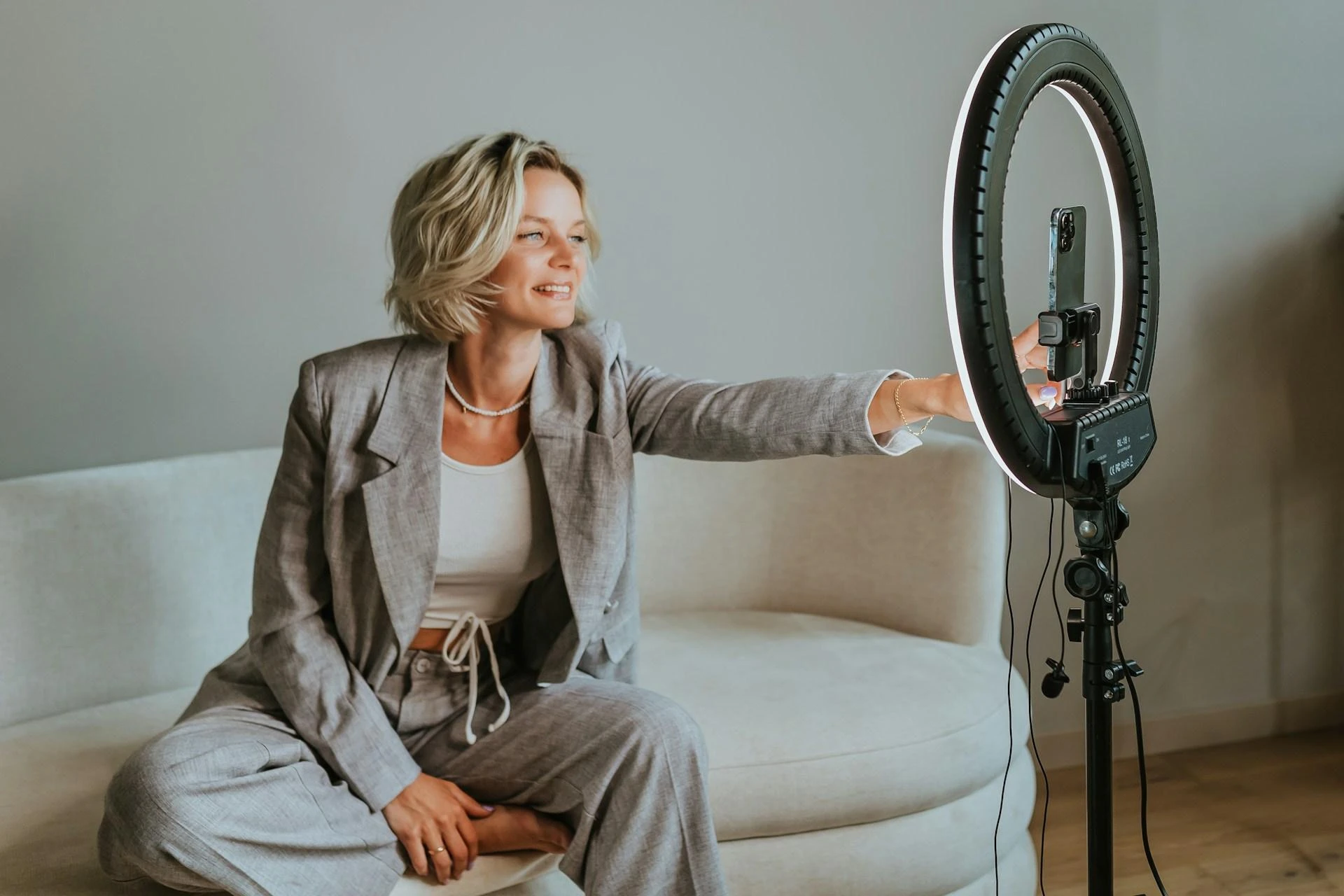 Content creator recording video with a ring light to promote an upcoming event