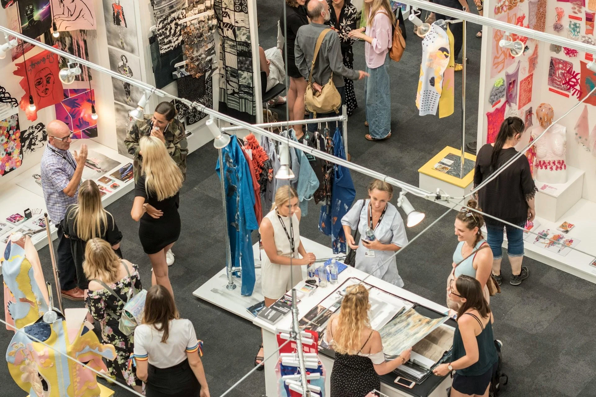 A fashion-based band stand with businesses interacting with potential customers, aerial photo angle