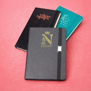 Foil print on a hardcover journal showing a gold metallic logo applied with heat and pressure