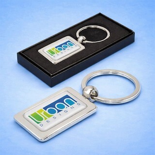 Resin coated finish on a hard product showing a crystal-clear domed logo with glossy raised 3D surface