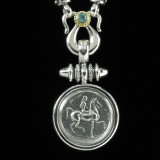 Lady Godiva Necklace Pendant handmade in Sterling Silver, 18 k Gold and accented with Blue Topaz by Bowman Originals, Sarasota, 941-302-9594.