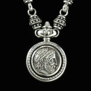 This handmade Sterling Silver Philip of Macedonia Necklace sports a detailed, embossed image of King Philip at the center, capturing the essence of his royal legacy. Ideal for adding a touch of royalty to any outfit. USA. Call or text 941-302-9594. www.BowmanOriginals.com This handmade Sterling Silver Philip of Macedonia Necklace sports a detailed, embossed image of King Philip at the center, capturing the essence of his royal legacy. Ideal for adding a touch of royalty to any outfit. USA. Call or text 941-302-9594. www.BowmanOriginals.com