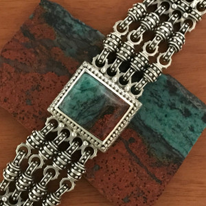 This dynamic handmade Sterling Silver Chainmail Chrysocolla Bracelet strikes a stunning balance between the beaded texture of the silver and the vibrant green hues of the chrysocolla. Made in the USA. 100% Guarantee. Call or text 941-302-9594. www.BowmanOriginals.com  This dynamic handmade Sterling Silver Chainmail Chrysocolla Bracelet strikes a stunning balance between the beaded texture of the silver and the vibrant green hues of the chrysocolla. Made in the USA. 100% Guarantee. Call or text 941-302-9594. www.BowmanOriginals.com