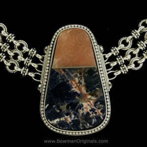 This Sodalite Alabaster Inlaid Pendant Chain Link Necklace  is a beautiful fusion of Celtic symbolism, hand-carved artistry, and vibrant gemstone accents—perfect for adding a touch of history and grace to any ensemble.Handmade in the USA. 100% Guarantee. Call or text 941-302-9594. Visit www.BowmanOriginals.com. 