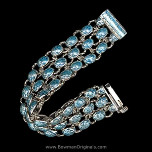 Handmade sterling silver laurel leaf bracelet with turquoise blue enamel by Bowman Originals, side view.