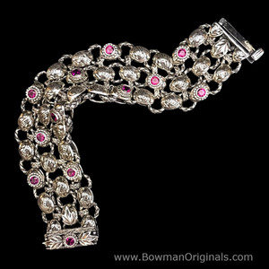 Flex of Handmade Sterling Silver Laurel Leaf Bracelet with Rhodolite Garnet and Dove Grey Enamel, Bowman Originals. Flex of Handmade Sterling Silver Laurel Leaf Bracelet with Rhodolite Garnet and Dove Grey Enamel, Bowman Originals.
