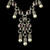 The Sterling Silver Garnet and Pearl Necklace is a vision of contrast: the passionate warmth of the garnet offset by the serene coolness of the pearl, their union both bold and harmonious wrapping the wearer in a subtle aura of sophistication and mystery. Handmade in the USA. 100% Guarantee. Call or text 941-302-9594. www.BowmanOriginals.com
