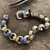 Sterling Silver and 18k Gold Laurel Leaf Hook Bracelet in works on a traditional work bench at Bowman Originals