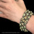 Woman wearing a Laurel Leaf Three Row Bracelet handmade in Silver, Gold, Enamel and Peridot,  Bowman Originals