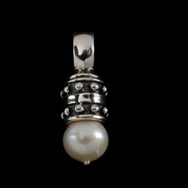 This exquisite pendant features a lustrous pearl delicately suspended from a sleek sterling silver cap. Perfect as a gift or as a personal indulgence, it symbolizes both natural beauty and enduring elegance. Made in the USA. 100% guarantee.Call or text 941-302-9594. www.BowmanOriginals.com
