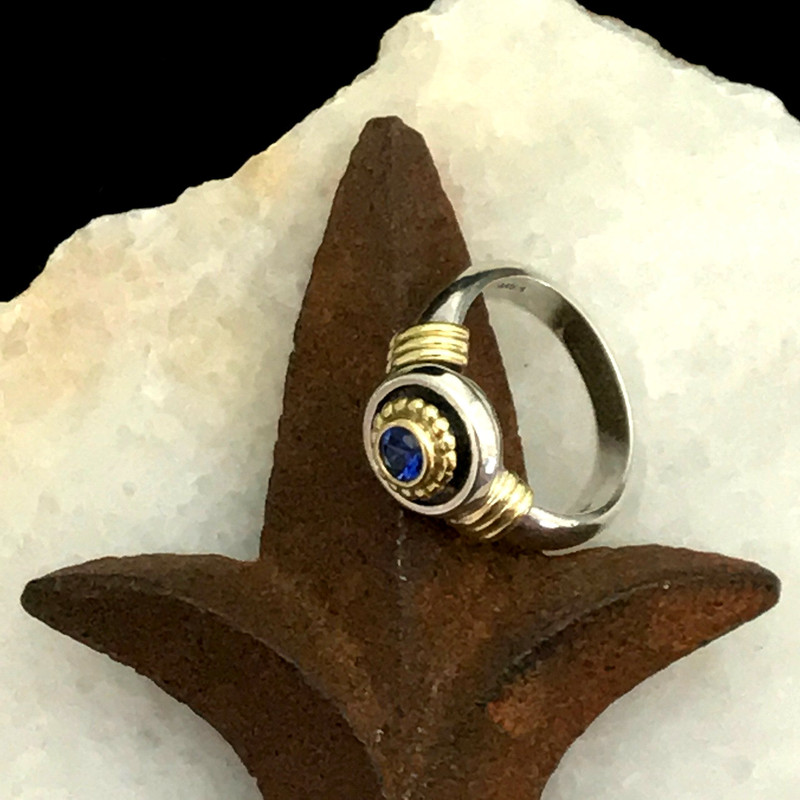 Cornflower Blue Sapphire featured in this handmade Sterling Silver and 18 k Gold ring by Bowman Originals, Sarasota, 941-302-9594.