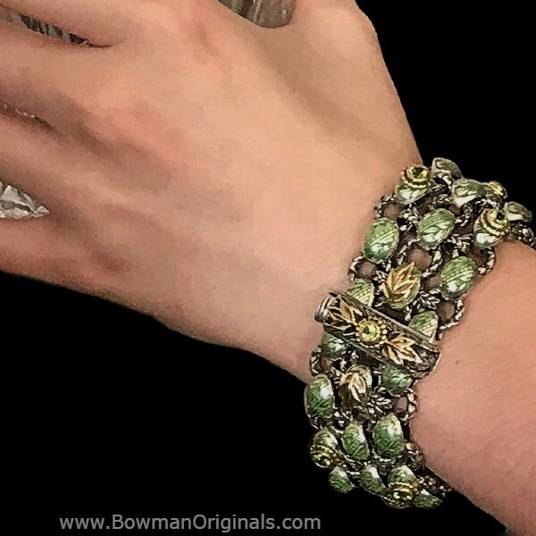 Woman wearing handmade Three Row Laurel Leaf Enamel Bracelet in Peridot Green by Ned Bowman of Bowman Originals