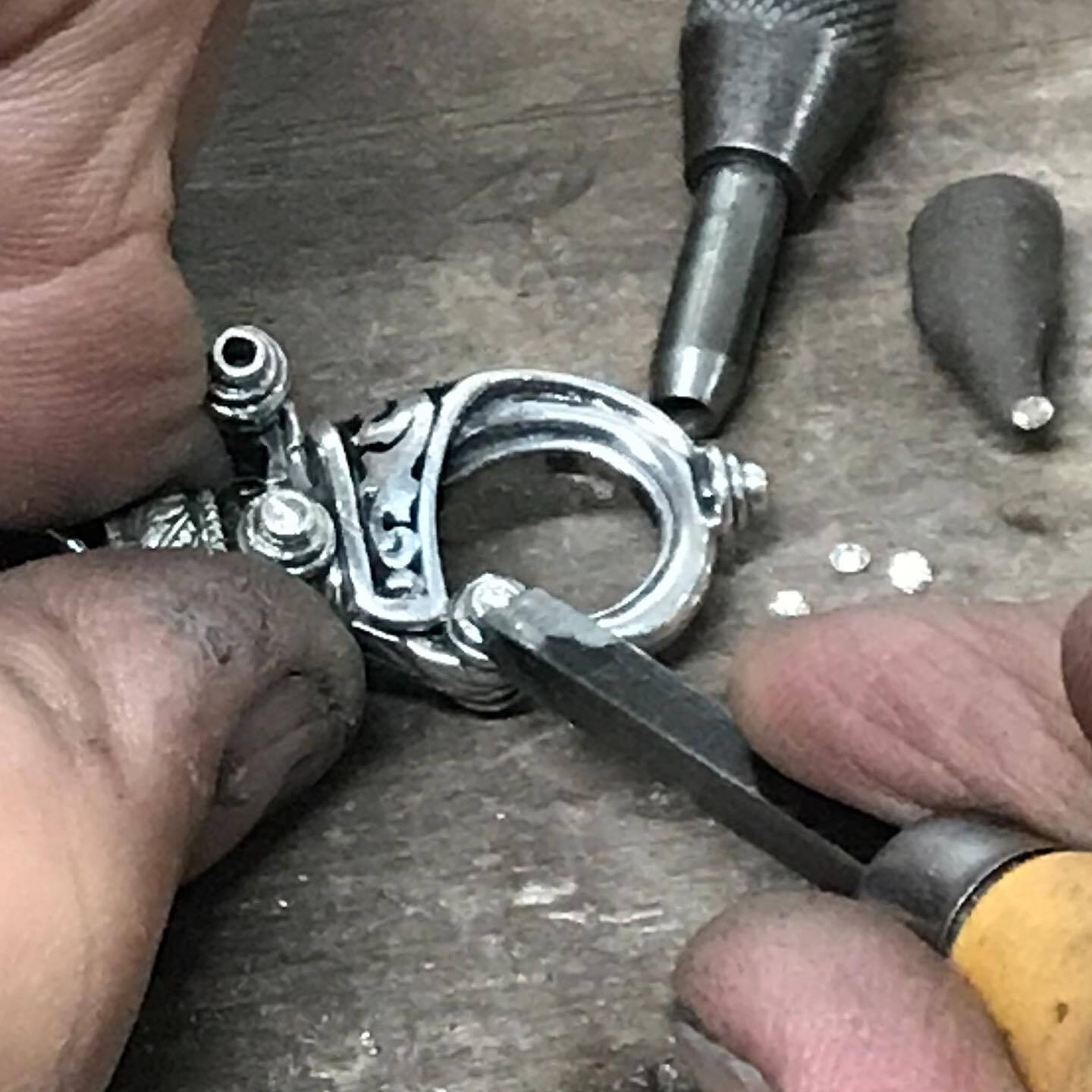 Setting Diamonds into a Sterling Silver and Black Enamel Hook Bracelet by Ned Bowman of Bowman Originals