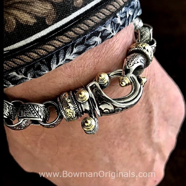 Wearing a handmade Hook Bracelet in Sterling Silver, 18k Gold and Chocolate Brown Enamel by Ned Bowman of Bowman Originals