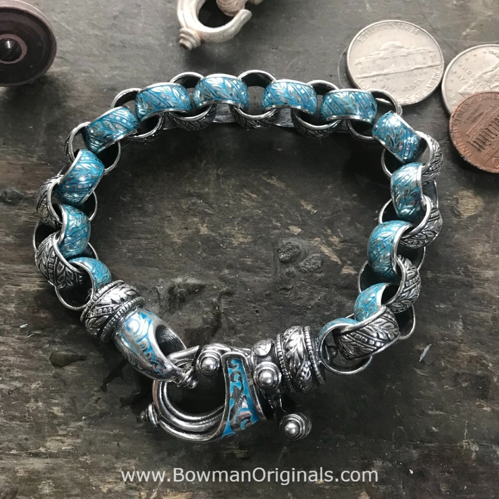A handmade bracelet on a workbench at Bowman Originals, from the Collection of Handcrafted Sterling Silver and 18k Gold Jewelry