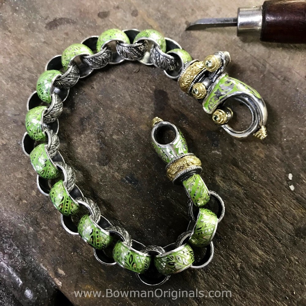 Handmade Sterling Silver, 18k Gold and Enamel Bracelet from our All Bracelets Collection on a workbench at Bowman Originals

