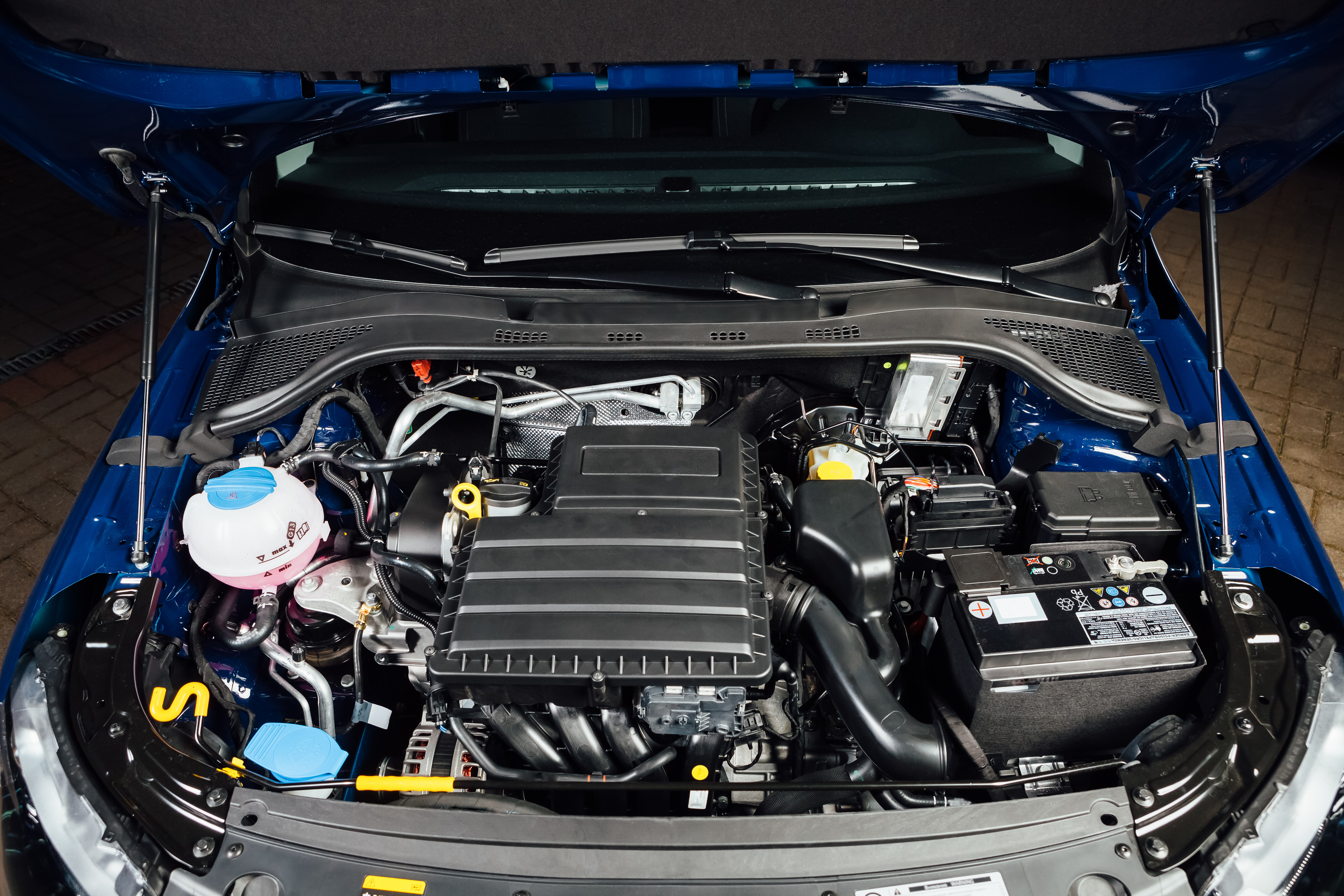 view under the hood of a blue vehicle