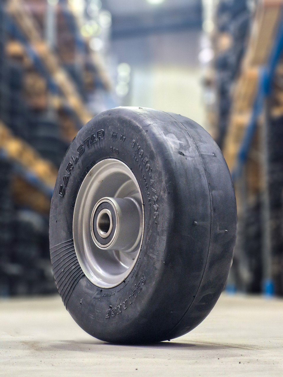 ASSEMBLY - 4"x2.10" Grey Steel Rim, 9/350-4 Solid Smooth Tyre, ¾" 6204 High Speed Bearings, (Reliance) (Mower Decks), (Pre-assembled)