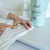 Mint Cleaning Laundry Booster | 900 grams - picture of product being used on clothing with the Mint brush Mint Cleaning Laundry Booster | 900 grams - picture of product being used on clothing with the Mint brush