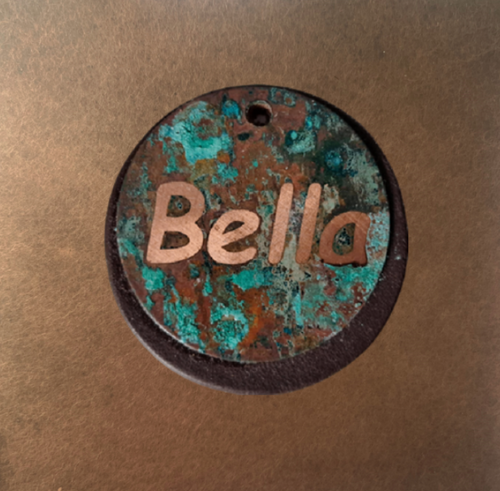 Antique copper name tag with premium full-grain vegetable-tanned leather backing — perfect as a bag charm, key ring, or keychain.