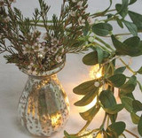 a unique christmas flower table arrangement