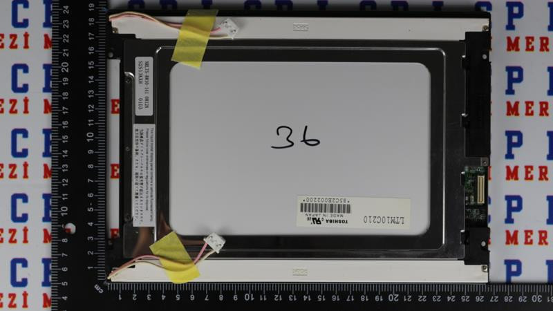 Rear view of LTM10C210 screen showing connector and Toshiba branding.