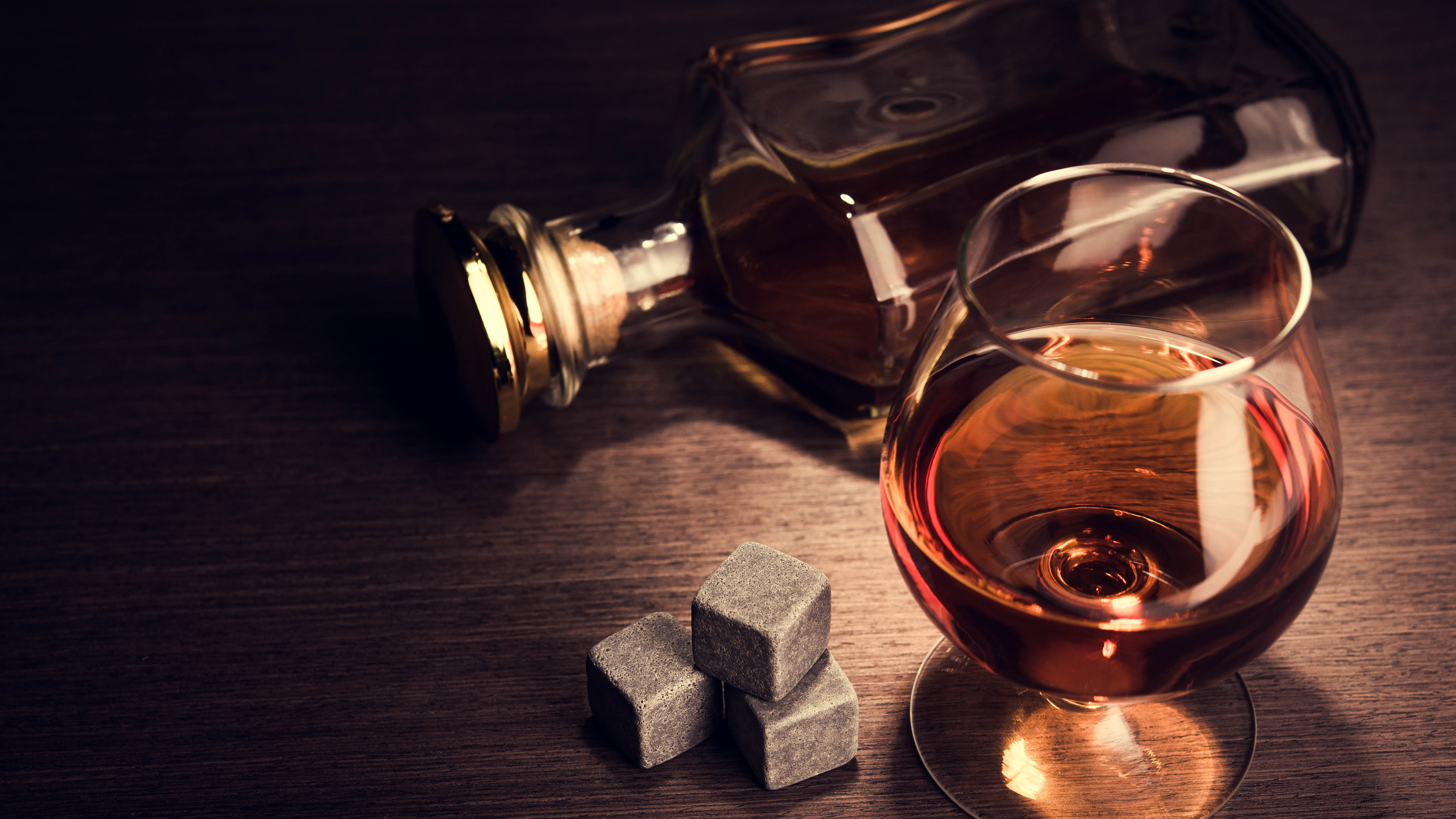 cognac-flat-lay-bottle-glass-and-cubes.jpg