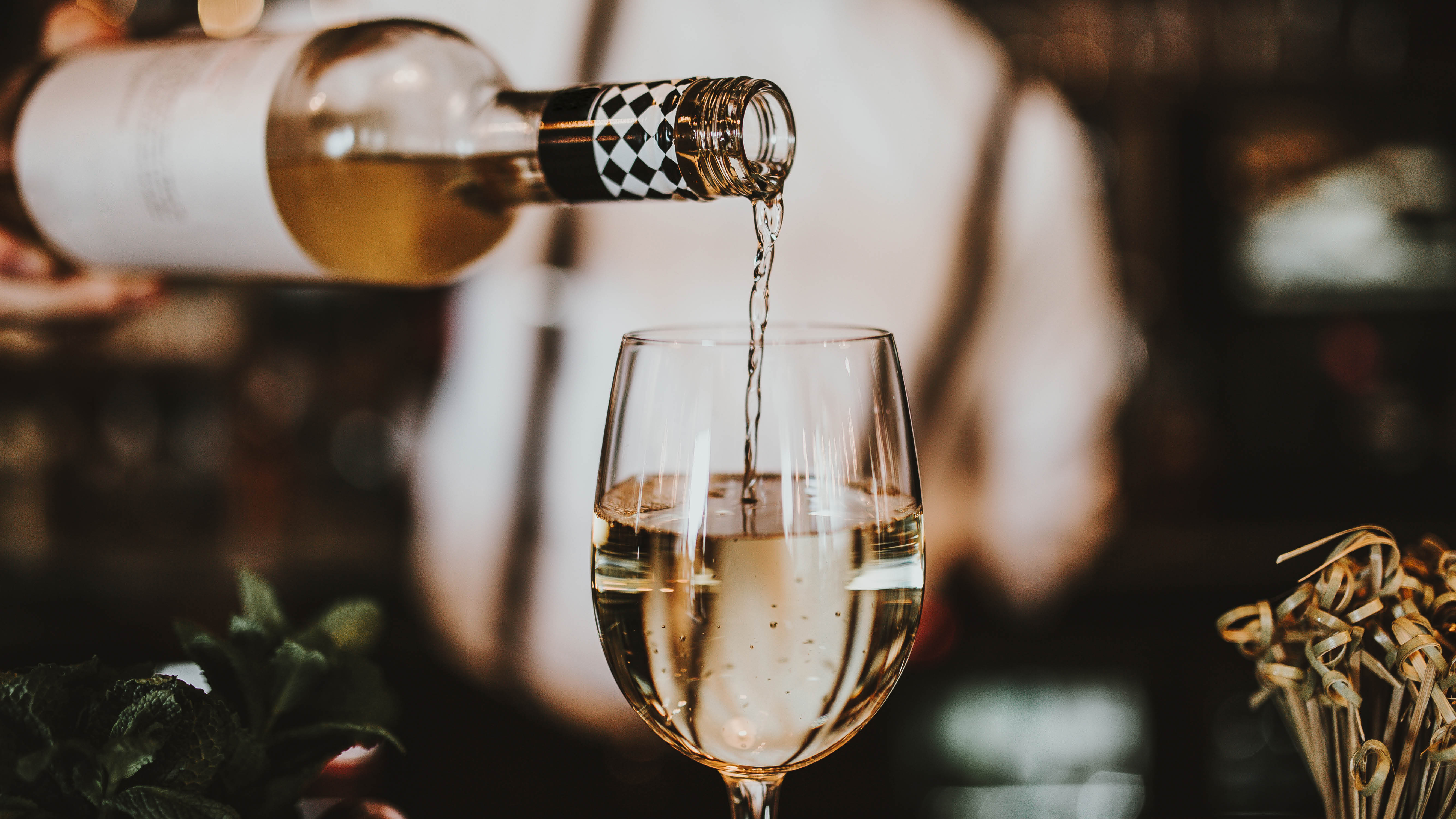wine-pouring-white-wine-into-glass-close-up.jpg
