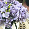 Purple Open Rose and Mixed Flower Arrangement With White Ceramic Vase