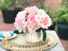 Pink Open Rose and Mixed Flower Arrangement With White Ceramic Vase