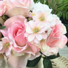 Pink Open Rose and Mixed Flower Arrangement With White Ceramic Vase