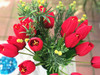 Red Tulip and Mixed Faux Flower Arrangements With White Ceramic Vase