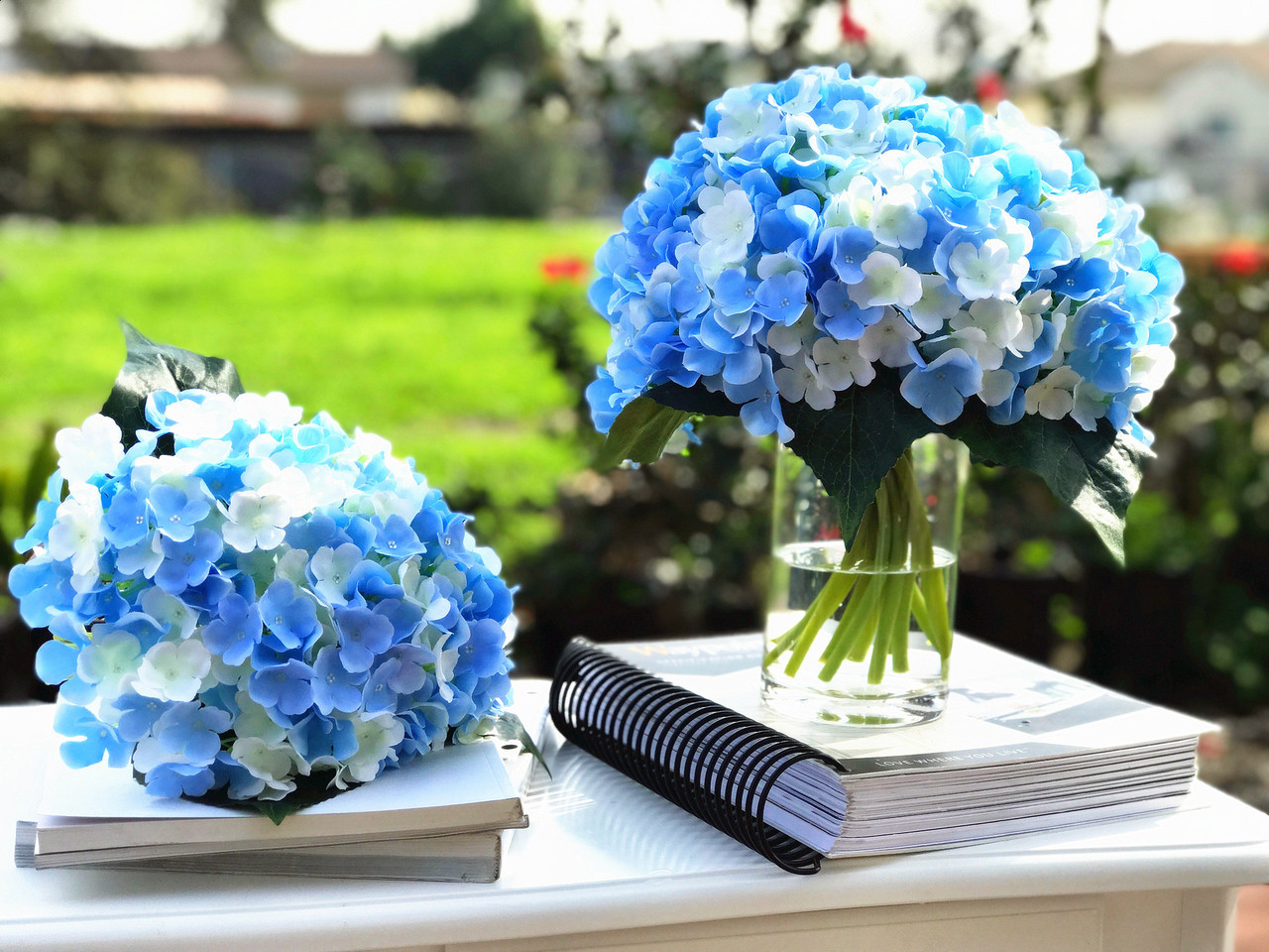 blue artificial flowers in vase