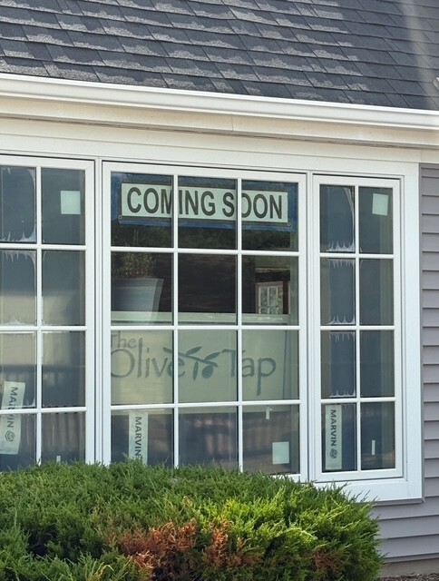 Window with a Coming Soon Sign