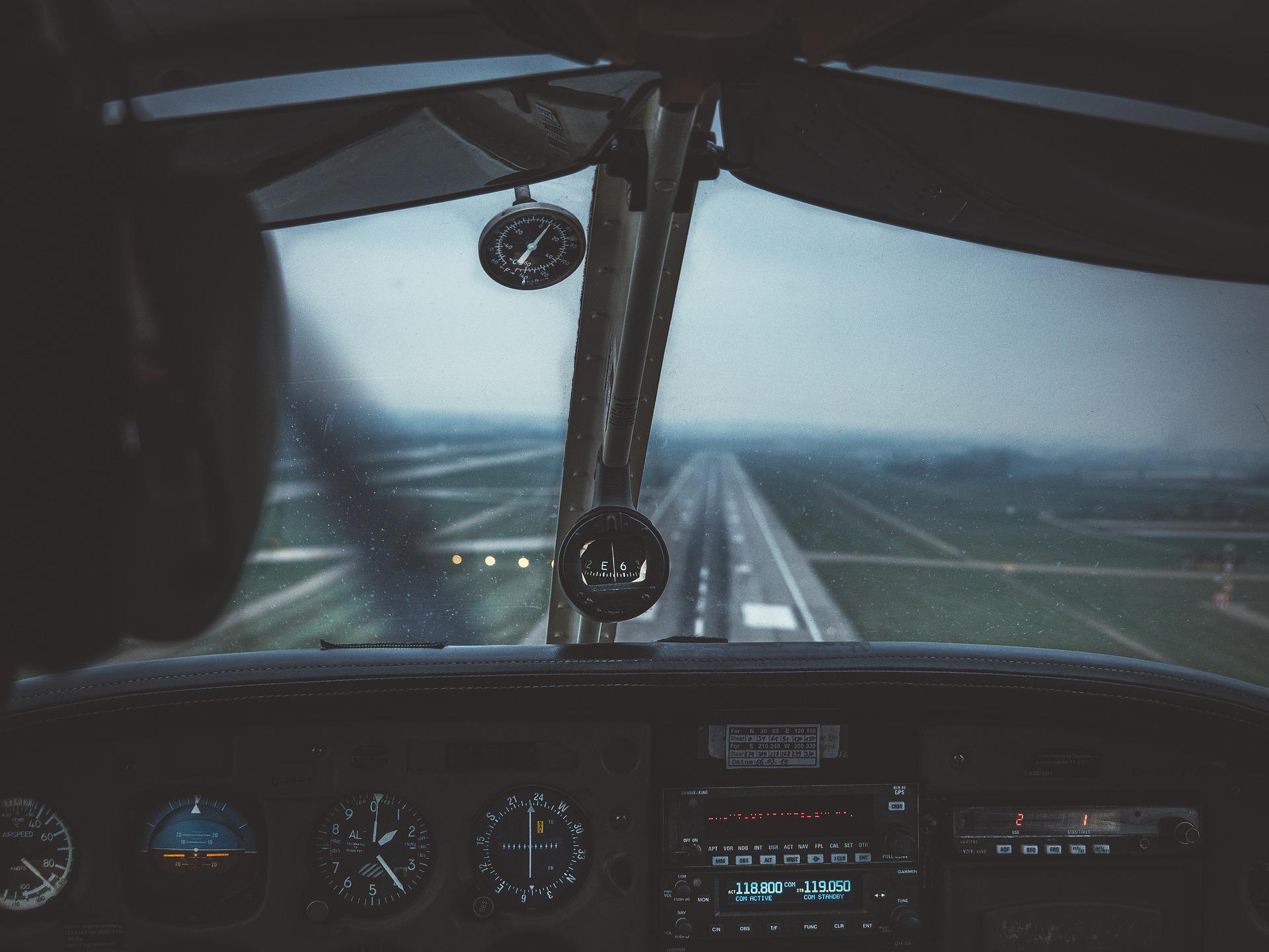 view of runway from aircraft cockpit