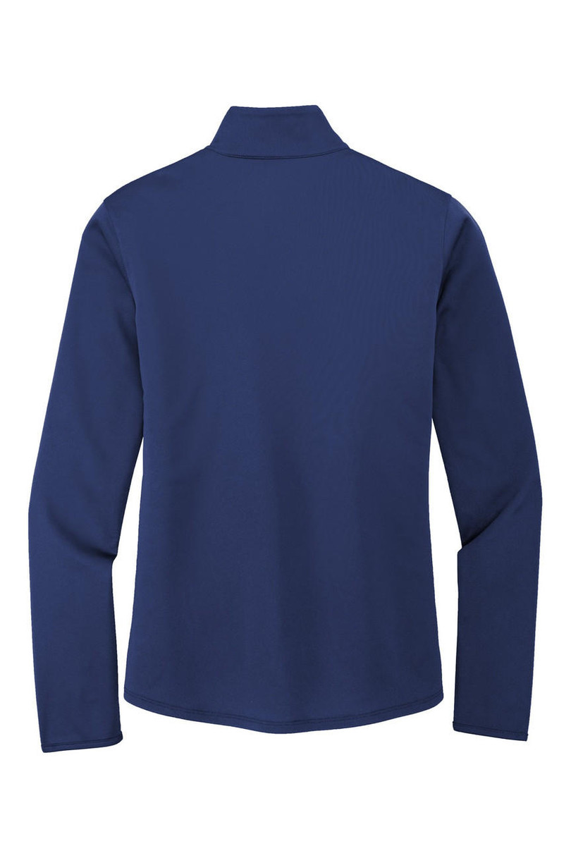 Women's performance top featuring cadet collar, contrast inner collar, and tag-free label