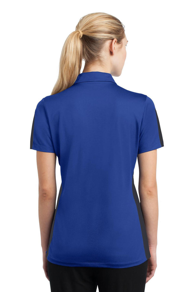 Women's colorblock polo with textured mesh and PosiCharge technology for color retention and breathability.